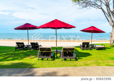 beach chair and umbrella with sea beach background beach chair and umbrella with sea beach background 89883996