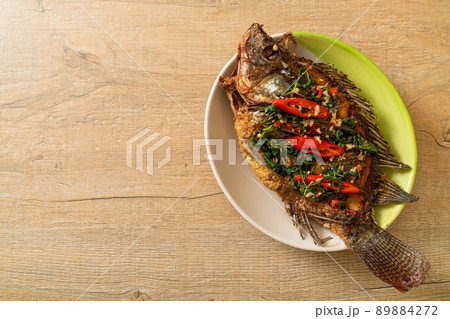 Fried Tilapia Fish with Basil chili garlic sauce 89884272