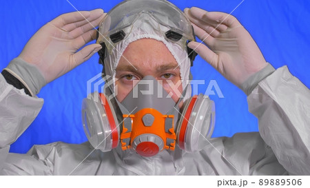 Scientist virologist in respirator. Man close up look, wearing protective medical mask. Concept health safety N1H1 coronavirus epidemic 2019 nCoV. 89889506