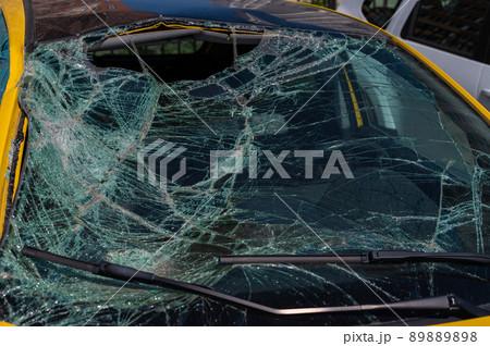 Broken windshield of a car Broken windshield of a car 89889898