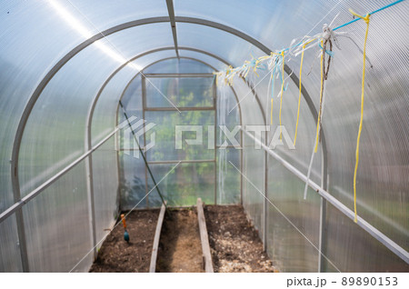 Empty small greenhouse in the countryside. 89890153