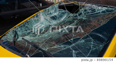 Broken windshield of a car Broken windshield of a car 89890154