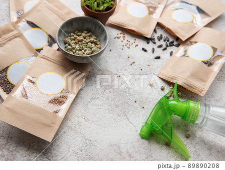 Microgreen seeds in paper bags and equipment for sowing microgreens. Microgreen seeds in paper bags and equipment for sowing microgreens. 89890208
