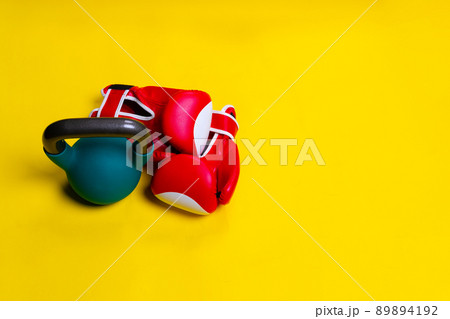 Kettlebell yellow space red box lue isolated iron object, from equipment gym in sport and powerlifting fist, competitive winner. Training hang cutout, conflict Kettlebell yellow space red box lue isolated iron object, from equipment gym in sport and powerlifting fist, competitive winner. Training hang cutout, conflict 89894192