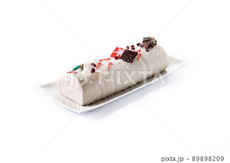White chocolate yule log cake with ornament 89898209