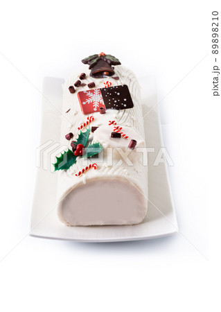 White chocolate yule log cake with ornament 89898210