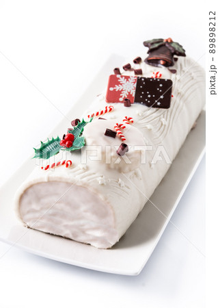 White chocolate yule log cake with ornament 89898212