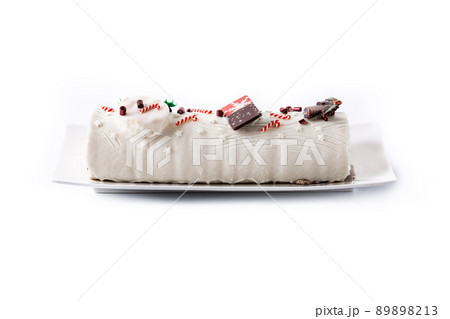 White chocolate yule log cake with ornament 89898213