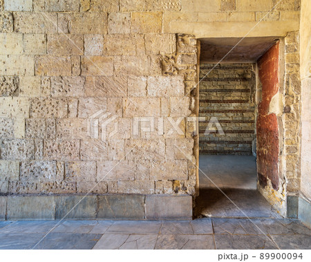 Bricks stone wall with opening revealing vacant room with bricks wall 89900094