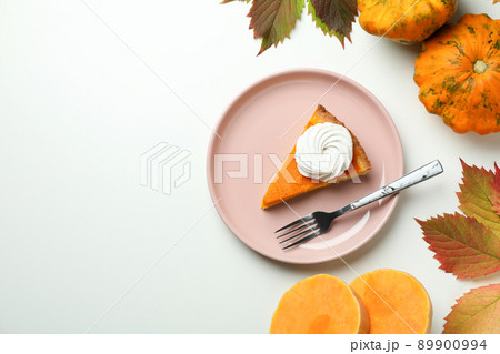 Concept of tasty food with pumpkin pie on white background 89900994