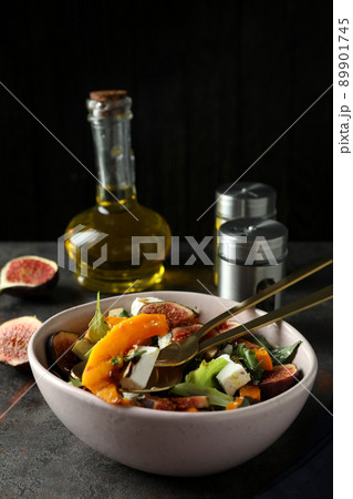 Concept of tasty eating with pumpkin salad on dark table 89901745
