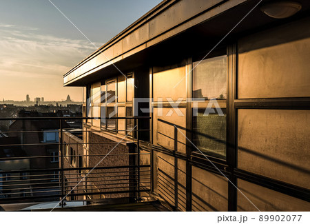cityscape view of a modern residential apartment terrace and its urban surroundings during a morning sunrise 89902077