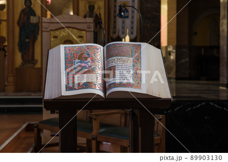Jette, Brussels Capital Region - Belgium -Detail of an old bible at the altar of the Our Lady of Lourdes catholic church Jette, Brussels Capital Region - Belgium -Detail of an old bible at the altar of the Our Lady of Lourdes catholic church 89903130