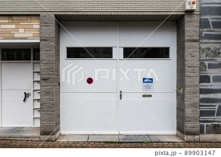 Jette, Brussels Capital Region - Vintage wooden garage port of an old local business Jette, Brussels Capital Region - Vintage wooden garage port of an old local business 89903147