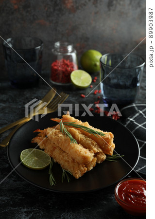 Concept of tasty food with deep-fried shrimp on dark table 89903987