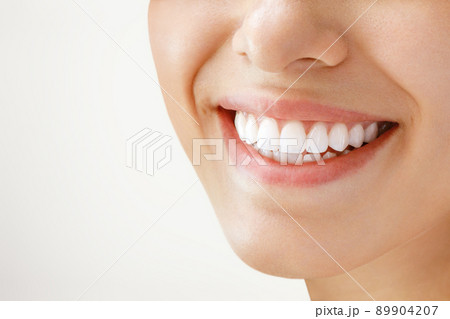 Beautiful female smile after teeth whitening procedure. Dental care. Dentistry concept. 89904207