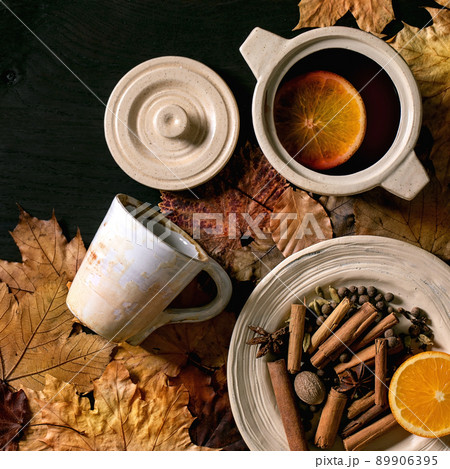 Hot mulled wine with spices and autumn leaves Hot mulled wine with spices and autumn leaves 89906395