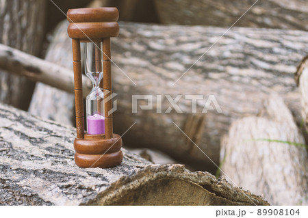 Hourglass as time passing concept for business deadline and running out of time. 89908104