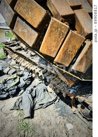 Kyiv region, Ukraine - May 15, 2022: War in Ukraine. Highway Kyiv - Zhytomyr. People take selfies against destroyed russian tank after russian atack in Febrary. 89908817