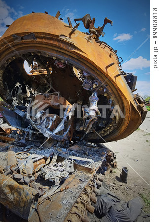 Kyiv region, Ukraine - May 15, 2022: War in Ukraine. Highway Kyiv - Zhytomyr. People take selfies against destroyed russian tank after russian atack in Febrary. 89908818