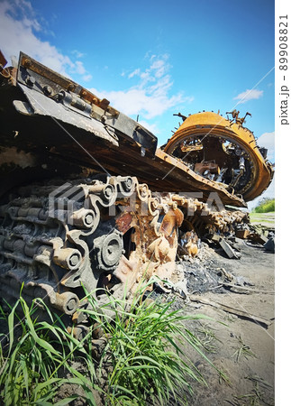 Kyiv region, Ukraine - May 15, 2022: War in Ukraine. Highway Kyiv - Zhytomyr. People take selfies against destroyed russian tank after russian atack in Febrary. Kyiv region, Ukraine - May 15, 2022: War in Ukraine. Highway Kyiv - Zhytomyr. People take selfies against destroyed russian tank after russian atack in Febrary. 89908821