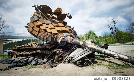 Kyiv region, Ukraine - May 15, 2022: War in Ukraine. Highway Kyiv - Zhytomyr. People take selfies against destroyed russian tank after russian atack in Febrary. 89908823