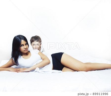 cute little boy in bed with mother in pajamas having fun happy smiling, lifestyle people concept close up cute little boy in bed with mother in pajamas having fun happy smiling, lifestyle people concept close up 89911996