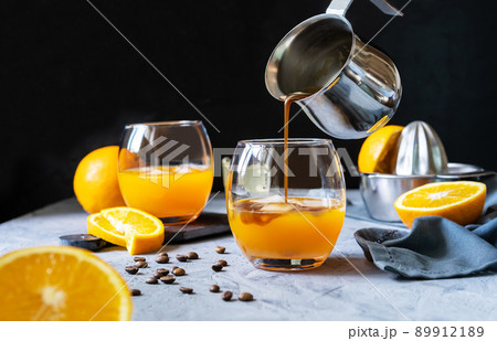 Coffee with orange juice and caramel syrup. Process of preparing Coffee with orange juice and caramel syrup. Process of preparing 89912189