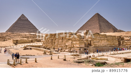 Tourists visiting the Giza Plateau with the Great Sphinx and the Giza pyramid complex in Cairo, Egypt 89915776