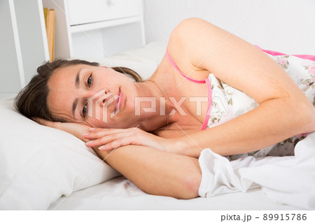 Portrait of adult woman in lingerie sleeping in bed 89915786