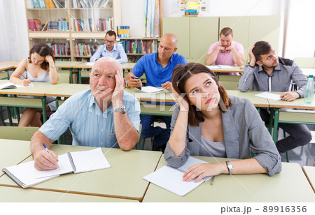 Sad students different ages listening task Sad students different ages listening task 89916356