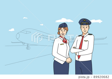 Happy pilot and stewardess near airplane 89920682