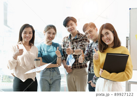 Group of Diversity People Team smiling and cheerful in success work at modern office. Creative teamwork feeling happy, enjoy and engage with achievement project 89927122