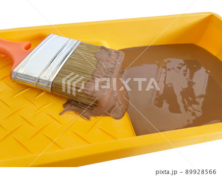 Green paint tray with brush on white background 89928566