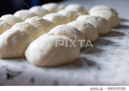Balls from the dough for pies. Baking at home. Selective focus. Balls from the dough for pies. Baking at home. Selective focus. 89929586