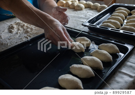 Woman cooking pies at home. Cooking and baking at home. Woman cooking pies at home. Cooking and baking at home. 89929587
