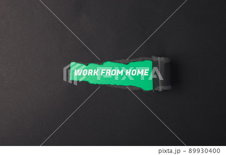 Phrase Work From Home on green background in torn paper Phrase Work From Home on green background in torn paper 89930400