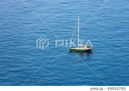 Green Sailing Boat Moored in the Blue Sea - Cinque Terre Liguria Italy 89930780