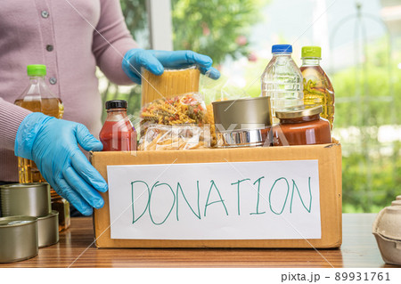 Foodstuff for donation, storage and delivery. Various food, pasta, cooking oil and canned food in cardboard box. Foodstuff for donation, storage and delivery. Various food, pasta, cooking oil and canned food in cardboard box. 89931761