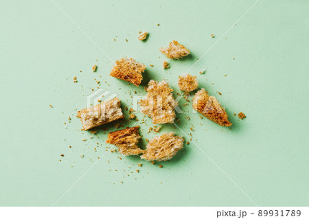 pieces and crumbs of a multigrain toast 89931789