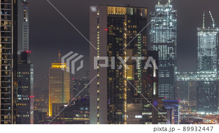 Aerial view of Dubai International Financial Centre district night timelapse Aerial view of Dubai International Financial Centre district night timelapse 89932447