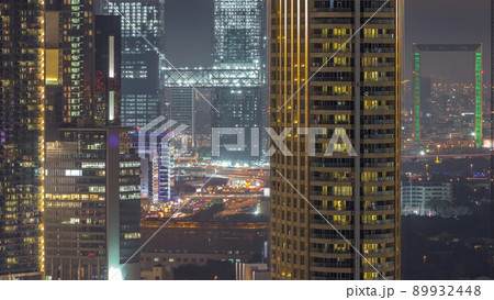 Aerial view of Dubai International Financial Centre district night timelapse Aerial view of Dubai International Financial Centre district night timelapse 89932448