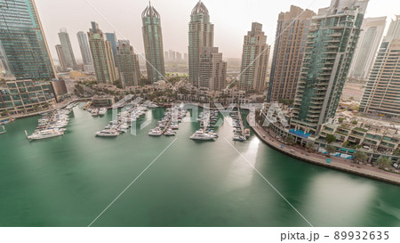 Luxury yacht bay in the city aerial timelapse in Dubai marina Luxury yacht bay in the city aerial timelapse in Dubai marina 89932635