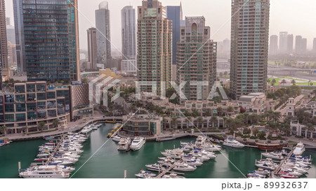 Luxury yacht bay in the city aerial timelapse in Dubai marina 89932637