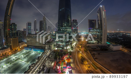 Panorama of Dubai International Financial district aerial night to day timelapse. View of business office towers. 89933197