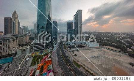 Dubai International Financial district aerial night to day timelapse. Panoramic view of business office towers. Dubai International Financial district aerial night to day timelapse. Panoramic view of business office towers. 89933198