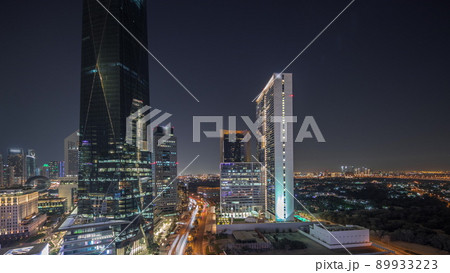 Dubai International Financial district aerial night timelapse. Panoramic view of business and financial office towers. 89933223