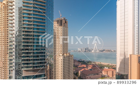Panoramic view of JBR area and the famous Ferris Wheel aerial morning timelapse 89933296