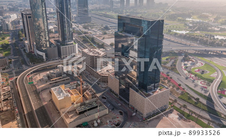 Aerial view of media city and al barsha heights district area all day timelapse from Dubai marina. Aerial view of media city and al barsha heights district area all day timelapse from Dubai marina. 89933526