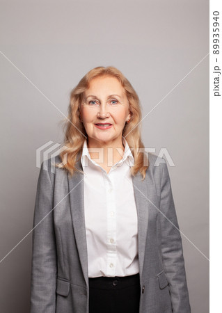 Portrait of a professional business woman smiling Portrait of a professional business woman smiling 89935940